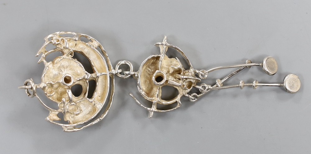 A suite of Norwegian 925s jewellery by Juhls Kautokeino, comprising a pendant brooch, 92mm, pair of drop earrings and a dress ring and one other dress ring by Juhls.